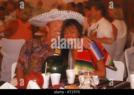 Couple enjoying party time on Mexican holiday Stock Photo