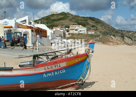 Brightly Painted Fishing Boat Beached at Salema Algarve Portugal Stock Photo