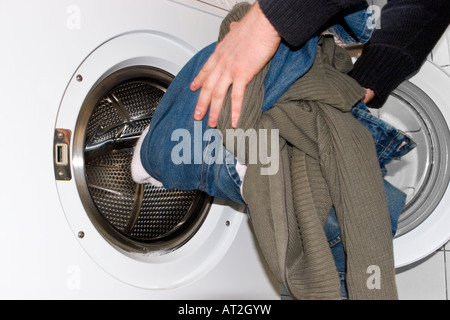 A Man Doing the Laundry Stock Photo
