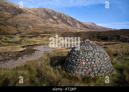 A stone cairn constructed on moorland in Glen Coe Lochaber Scotland Stock Photo