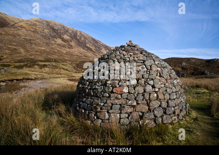 A stone cairn constructed on moorland in Glen Coe Lochaber Scotland Stock Photo