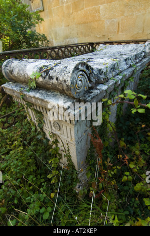 Overgrown ornate tombstone Stock Photo