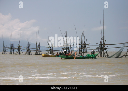 Fishing boats and nets in the South China Sea on the way to Bako National Park, Sarawak, Borneo, Malaysia Stock Photo