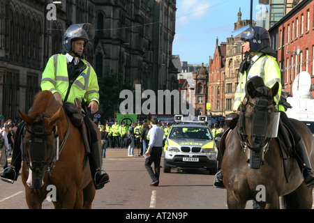 Two police officers on Horseback, during a rally in manchester against the iraq war, during the labour party conference. Stock Photo