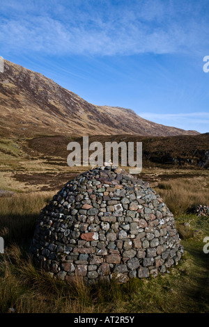 A stone cairn constructed on moorland in Glen Coe Lochaber Scotland Stock Photo