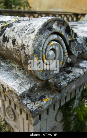 Close-up of ornate moss-covered tombstone Stock Photo