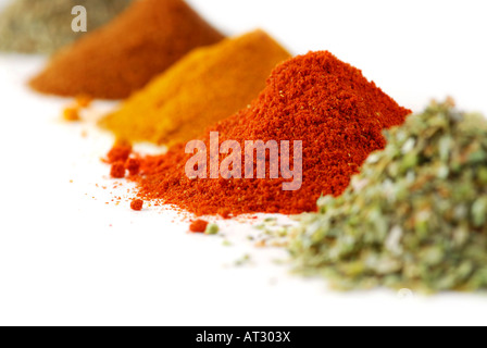 Heaps of various ground spices on white background Stock Photo