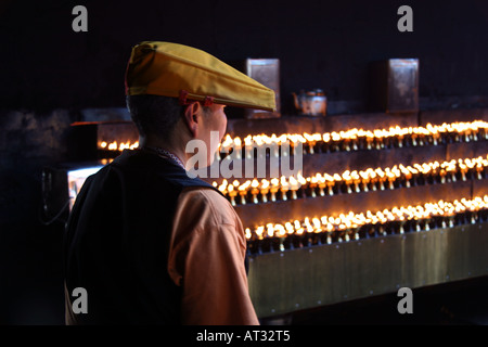 Pilgrim in the candle room in Jokhang Temple, Barkhor Square, Lhasa, Tibet, China Stock Photo