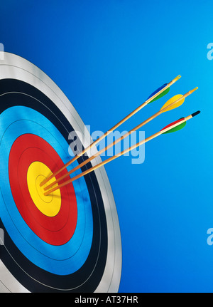 Three arrows in the centre of a target board Stock Photo