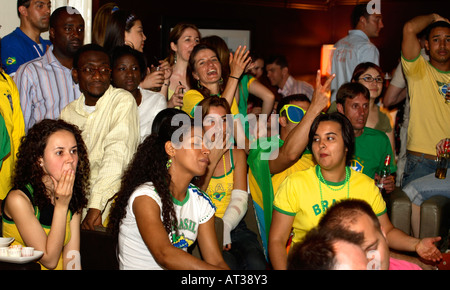 Brazilian fans cheering on their team in 2006 World Cup quarter-final vs France, On Anon Bar, London Stock Photo