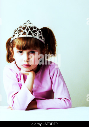 A girl wearing a pink top and tiara Stock Photo