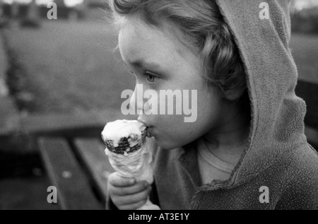 A young girl eating an ice cream Stock Photo