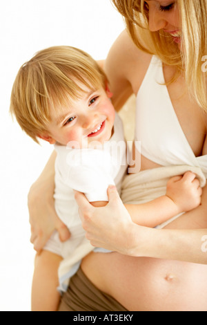 Smiling young boy in mother's arms, close-up Stock Photo