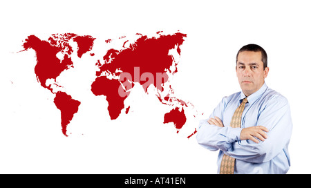 Business man standing next to a world map Stock Photo