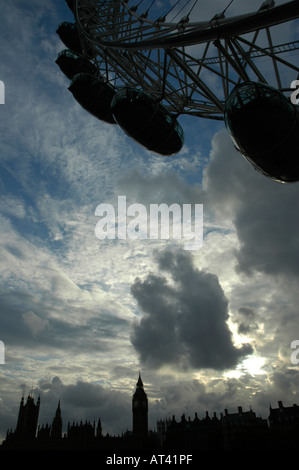 Silhouette of London Eye Ferris wheel and Houses of Parliament against strikingly dramatic evening sky Stock Photo