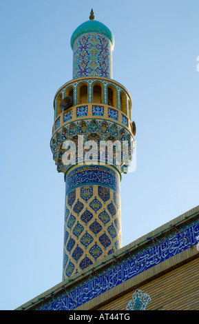 Minaret of Iranian mosque decorated with Persian mosiac tile. Stock Photo
