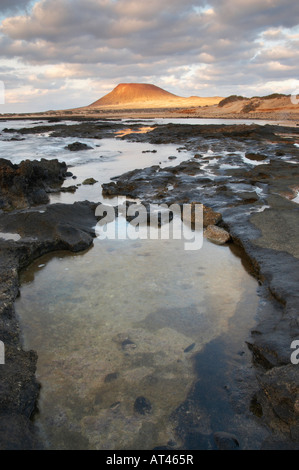 Sunrise on Montaña Amarilla (yellow mountain) on La Graciosa island near  Lanzarote in the Canary islands Stock Photo