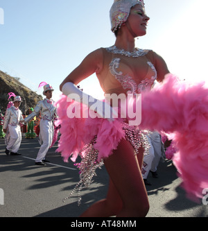Young dancer swirls her feathered costume in th Carnaval parade Los Gigantes Tenerife Canary Islands Spain Stock Photo