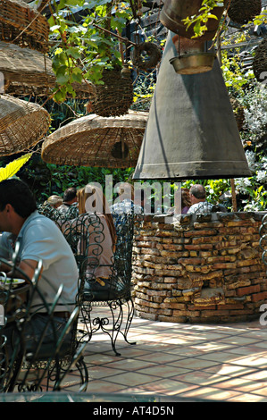 Diners eating at an outdoor restaurant in Rosarito Beach Mexico Stock Photo