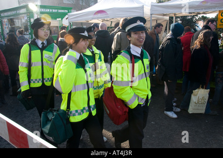 Four St Johns ambulance first aid workers at Chinese new year celebrations Liverpool England UK Stock Photo