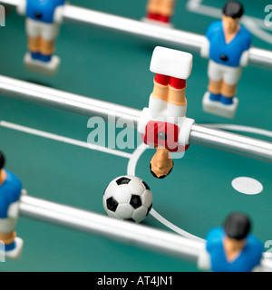 table football player heading a ball foosball Stock Photo