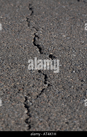 crack in the road caused by expansion contraction and subsidence tenerife canary islands spain Stock Photo