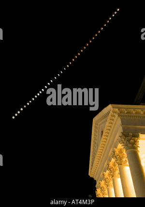 A total lunar eclipse was visible over the Rotunda at the University of Virginia in Charlottesville Virginia on February 20 2008 Photo illustration was created from a composite of 39 photographs taken in roughly 5 minute intervals by a Canon EOS 1D Mark III digital camera with Canon EF 16 35mm f 2 8L lens Stock Photo