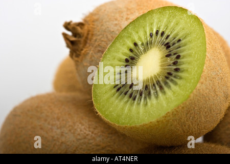 Green Kiwi fruit split in half Actinidia chinensis var deliciosa images  pictures photos images large high resolution horizontal in USA US hi-res Stock Photo