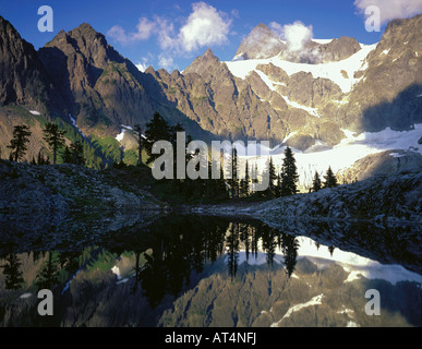 North Cascades National Park WA Afternoon sun on Mount Shuksan with a mirror reflection in Lake Ann Stock Photo