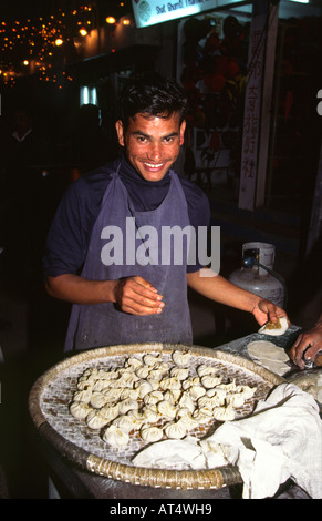Nepal Kathmandu food man making Momos steamed dumplings Stock Photo