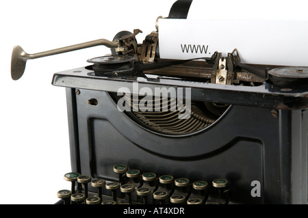 An old ancient typewriter is used to type an internet address Isolated on white Stock Photo