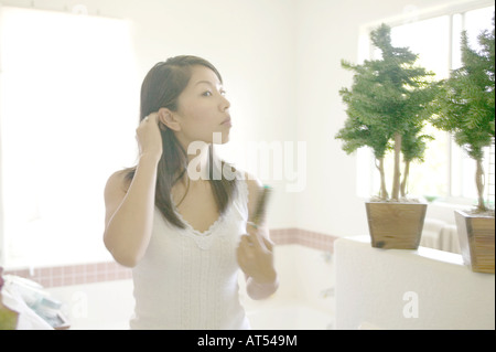Woman Brushing Her Hair Stock Photo