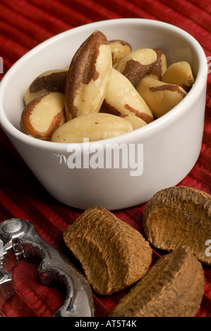 Brazil Nuts in ceramic dish with nutcrackers Stock Photo