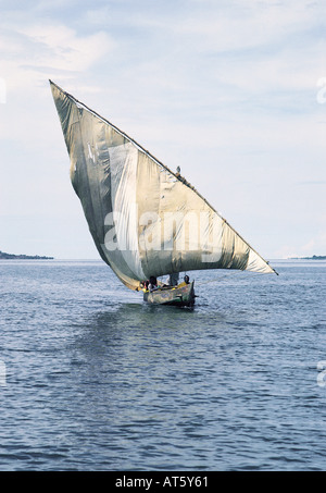 A traditional Luo sailing canoe with Jaluo fishermen on board near Mfangano Island Lake Victoria Kenya East Africa Stock Photo