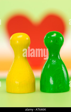 Game pieces, heart in background Stock Photo