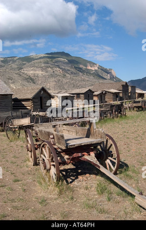 Wooden wagons and log cabins are features at Old Trail Town near Cody, WY. Stock Photo