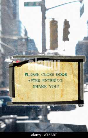 Please Close Door After Entering Thank You Sign on a Door Stock Photo
