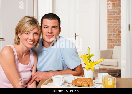 Young couple having breakfast, close-up, portrait Stock Photo