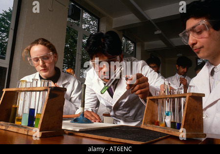 Pupils at Hendon School in London perform an experiment in a Chemistry lesson Stock Photo
