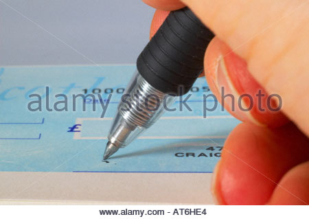 Hand Write 'em Cheque Close up of a pen and cheque. Writing a cheque Stock Photo - Alamy