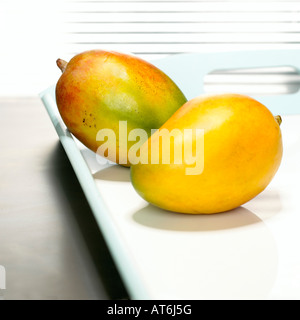 Mangos on tray, close-up Stock Photo