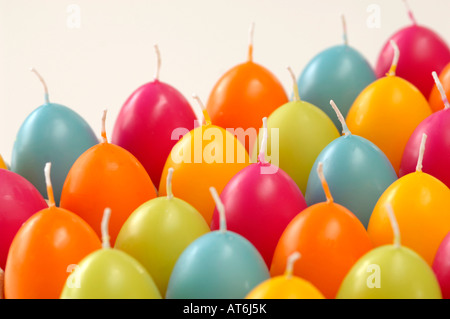 Egg-shaped candles in cardboard box Stock Photo