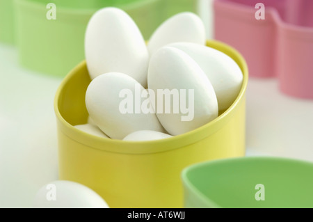 Eggs in yellow bowl, close-up Stock Photo