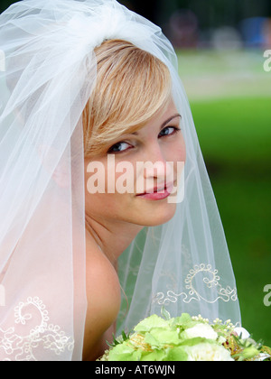 Portrait of beautiful bride in wedding dress and veil. Stock Photo