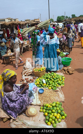 Woman selling fruit on the roadside next to the outdoor market in Mopti. Mali Stock Photo