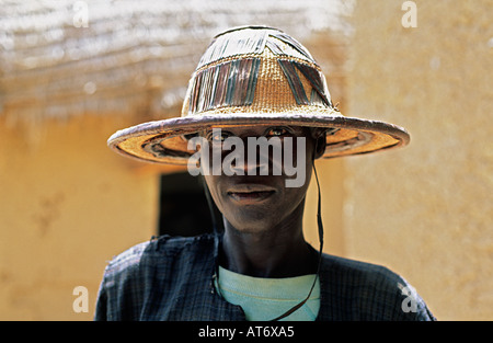 Portrait of a young man from the Bozo tribe wearing a traditional hat, in the village of Dagua Womina, Malibozo hots Stock Photo