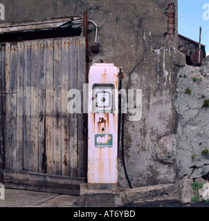 An old petrol station door and building and petrol pump  not in use in Gwynedd North Wales UK   KATHY DEWITT Stock Photo