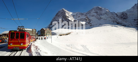 Jungfraujoch train at Kleiner Scheidegg in winter , with from left, The Eiger, The Monch then The Jungfrau Stock Photo