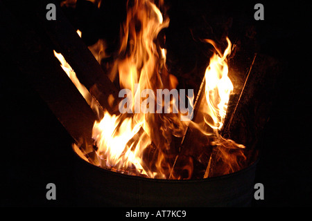 Burning bin incinerator fire Stock Photo - Alamy