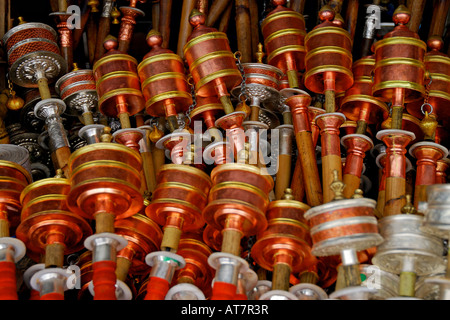 Prayer wheels for sale at a market stall Barkhor Square Lhasa Tibet Stock Photo